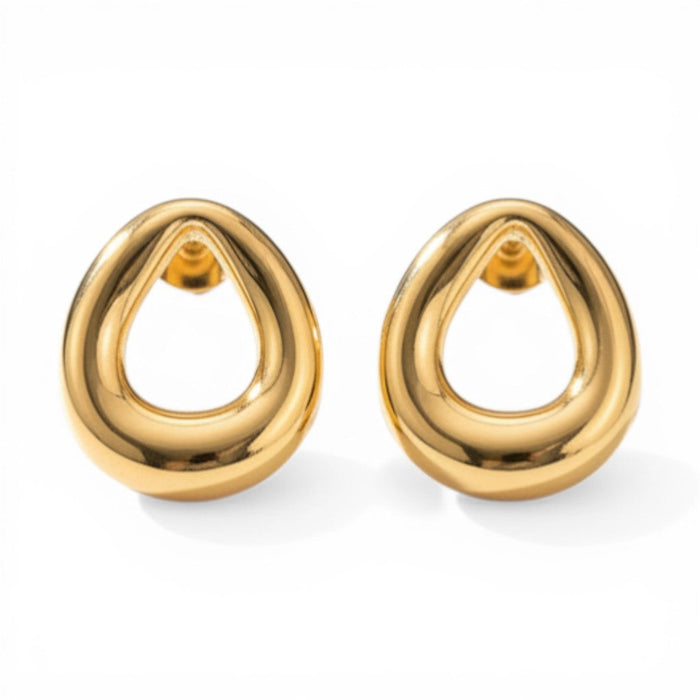 Nia Dome Twist Studs in 18K gold PVD-plated finish, product shot on white background