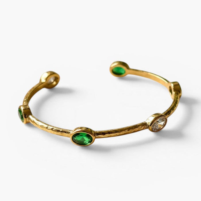 Emerald Halo Open Bangle in 18K gold-plated finish, product shot on white background