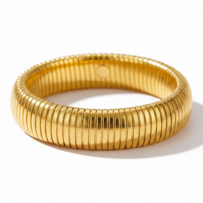 Twist Coil Street Bangle in 18K gold PVD-plated finish, product shot on white background