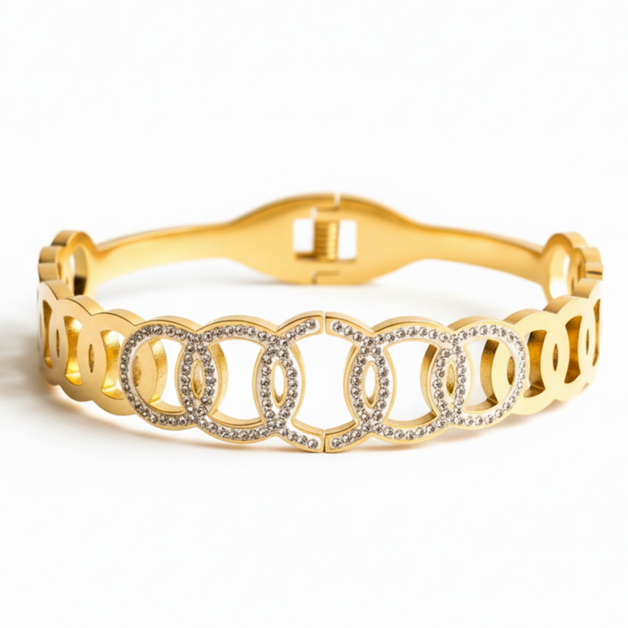 Lumière Linked Circles Bangle in gold-plated finish, product shot on white background