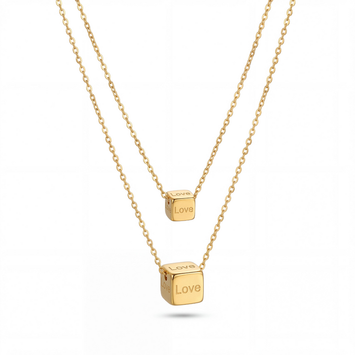 Aura Dual Layer Cube Necklace in gold PVD-plated finish, product shot on white background