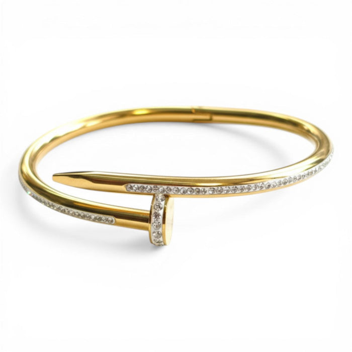 Nadia Nail Edge Cuff in 18K gold PVD-plated finish, product shot on white background