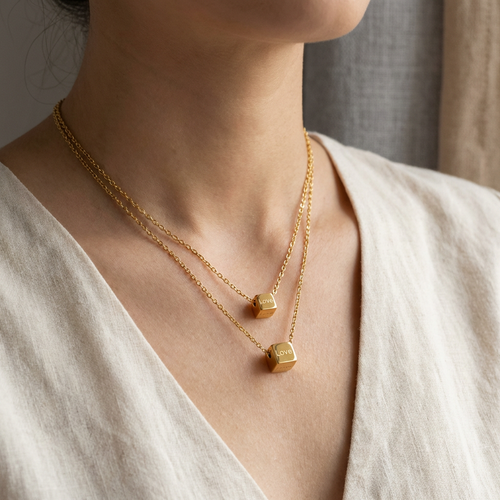 Aura Dual Layer Cube Necklace in gold PVD-plated finish worn on the neck