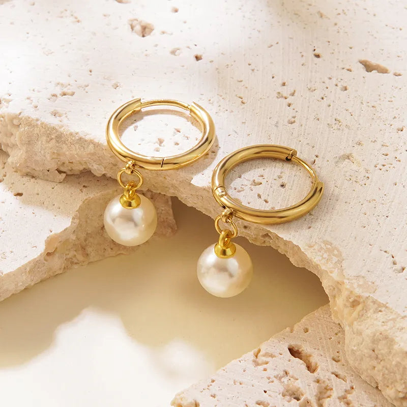 Noelle Pearl Drop Hoop Earrings, styled flat lay