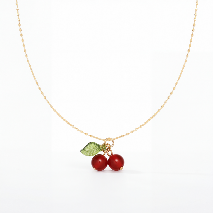 Ruby Cherry Pendant Necklace in 18K gold PVD-plated finish, product shot on white background