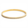 Celeste Eternity Line Bangle in 18K gold PVD-plated finish, product shot on white background