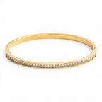 Celeste Eternity Line Bangle in 18K gold PVD-plated finish, product shot on white background