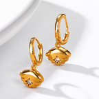 Celeste Zircon Charm Earrings in 18K gold PVD-plated finish, product shot on white background