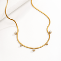 Amelia Multi Charms Zircon Necklace in 18K gold PVD-plated finish, product shot on white background