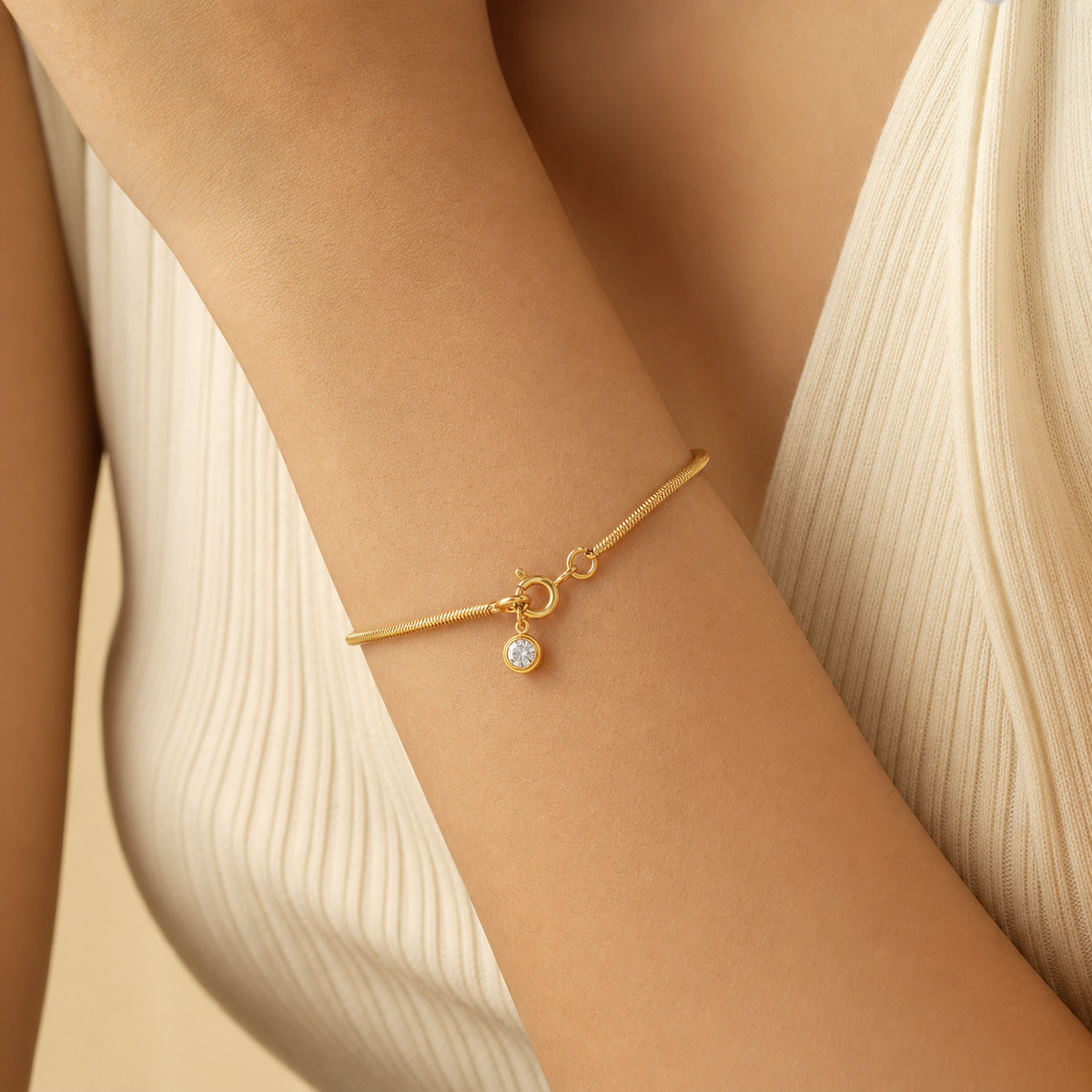 Ariana Snake Chain Bracelet in 18K gold PVD-plated finish worn on the wrist