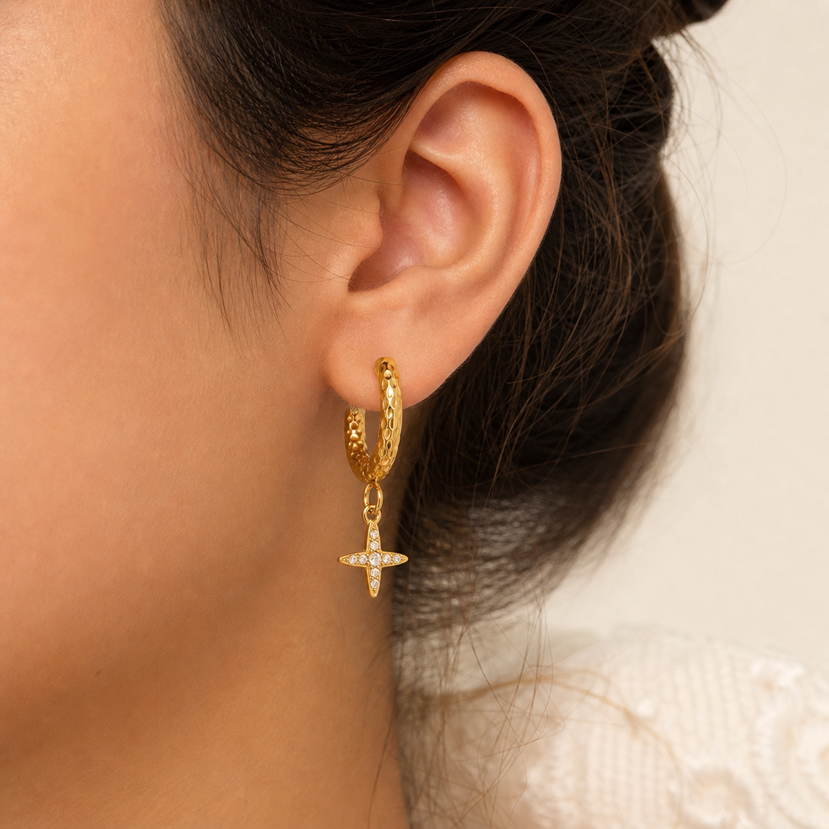 Clara Luxurious Zircon Tassel Earrings in 18K gold PVD-plated finish worn on the ear