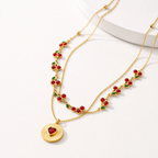 Lila Berry Heart Necklace in gold-tone finish, product shot on white background