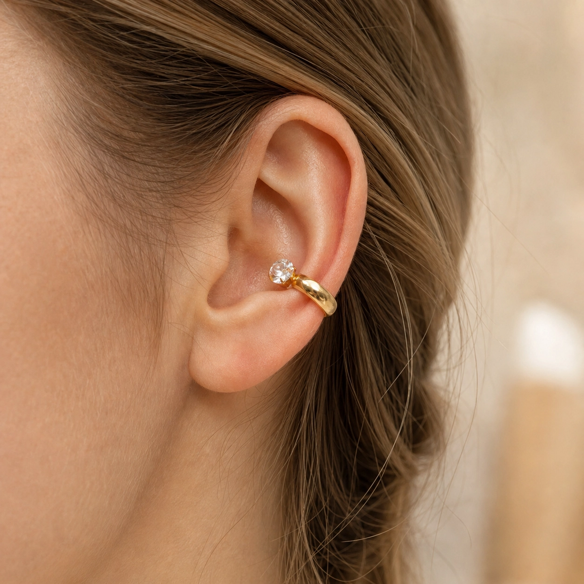 Noor Zircon Ear Cuffs in 18K gold PVD-plated finish worn on the ear