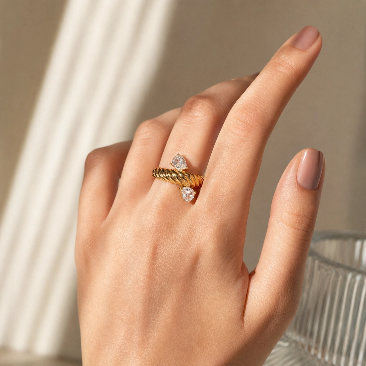 Luna Twisted Open Ring in 18K gold PVD-plated finish worn on the hand