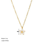 Pretty Shimmering Things gold-tone floral pendant necklace with cubic zirconia petals and a central gold bead.