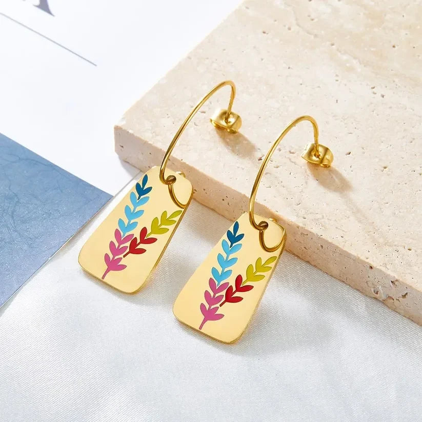 Aurora Color Leaf Earrings, styled flat lay