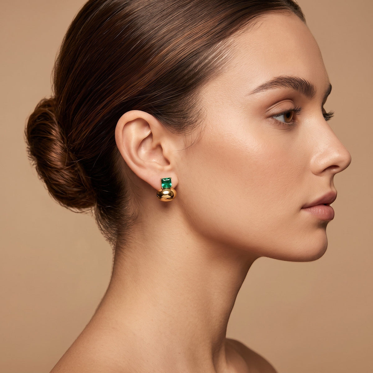 Tara Zircon Drop Earrings in 18K gold PVD-plated finish worn on the ear