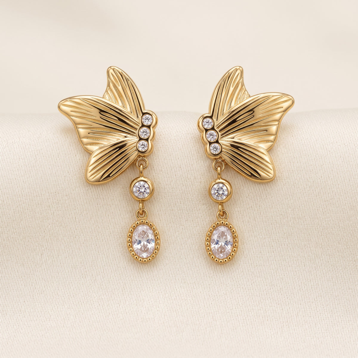 Noa Butterfly Earrings, styled flat lay