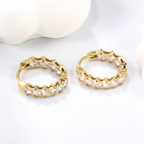 Lyra Crystal Hoop Clips, styled flat lay