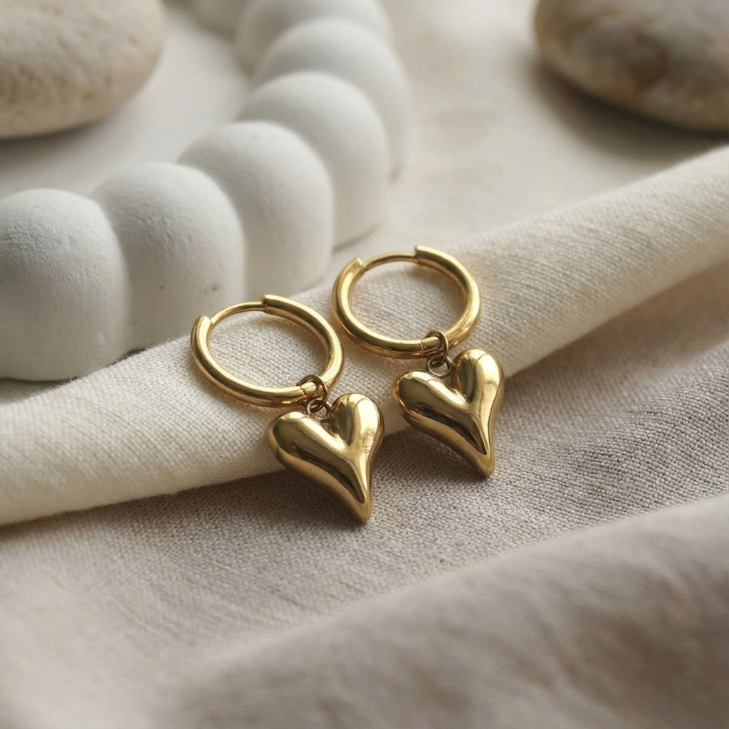 Lena Puff Heart Huggie Earrings, alternate angle on a display
