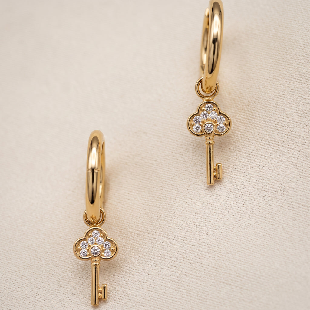 Meher Crystal Key Drop Earrings, styled flat lay