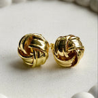 Nova Gloss Knot Earrings, styled flat lay