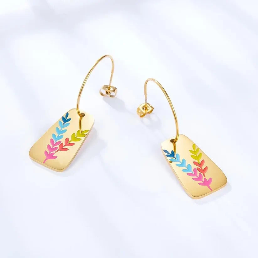 Aurora Color Leaf Earrings, close-up on a display