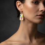 Aurora Color Leaf Earrings in 18K gold-plated finish worn on the ear