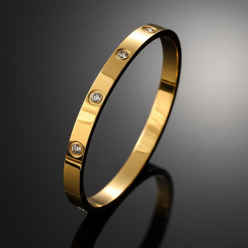 Pretty Shimmering Things Global Stella vintage 18K gold plated stainless steel bangle with round rhinestone accents