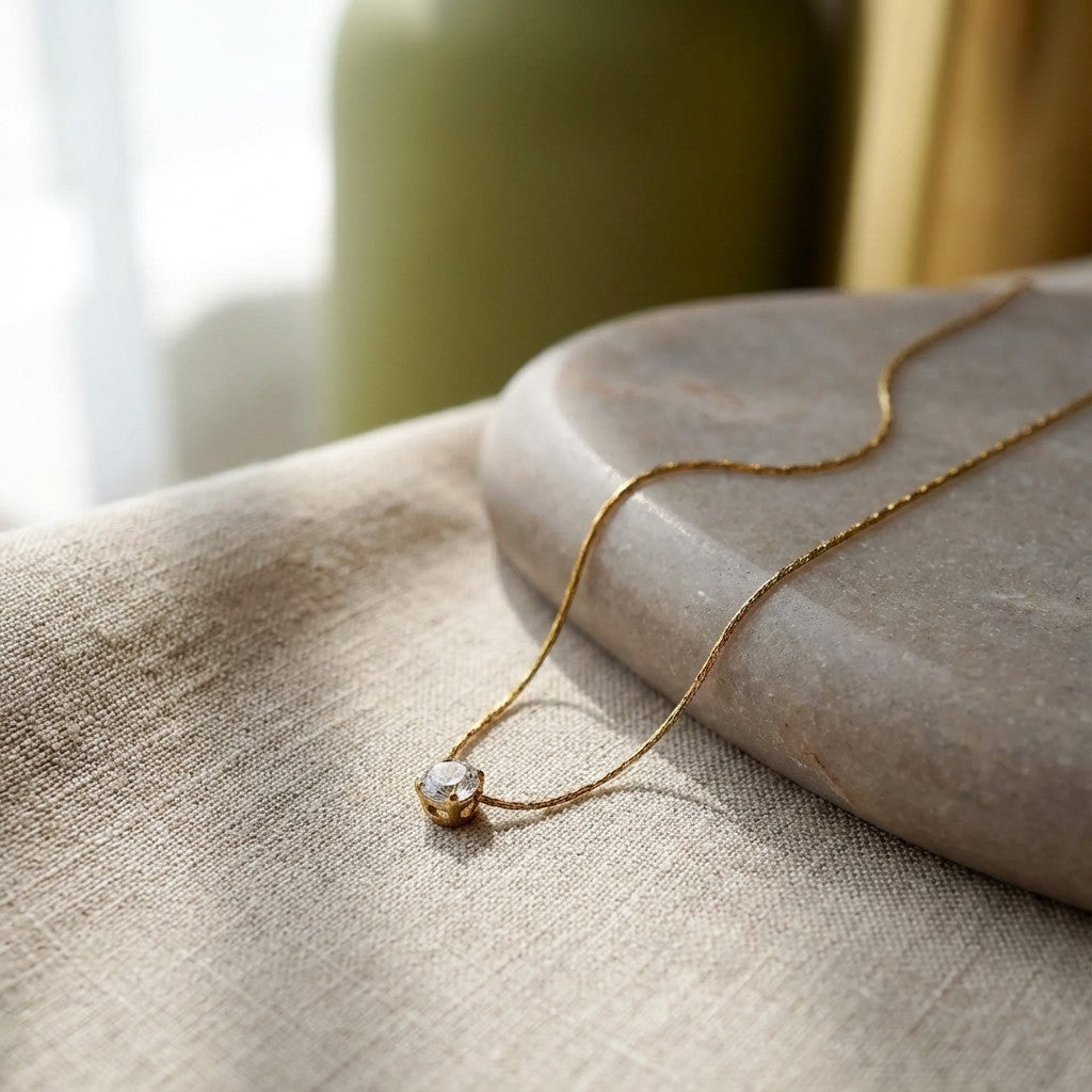 Solitaire Glow Promise Necklace, styled flat lay