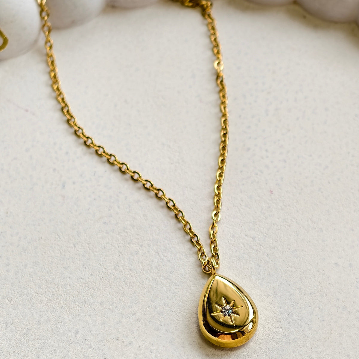 Stella Dewdrop Necklace, close-up on a display