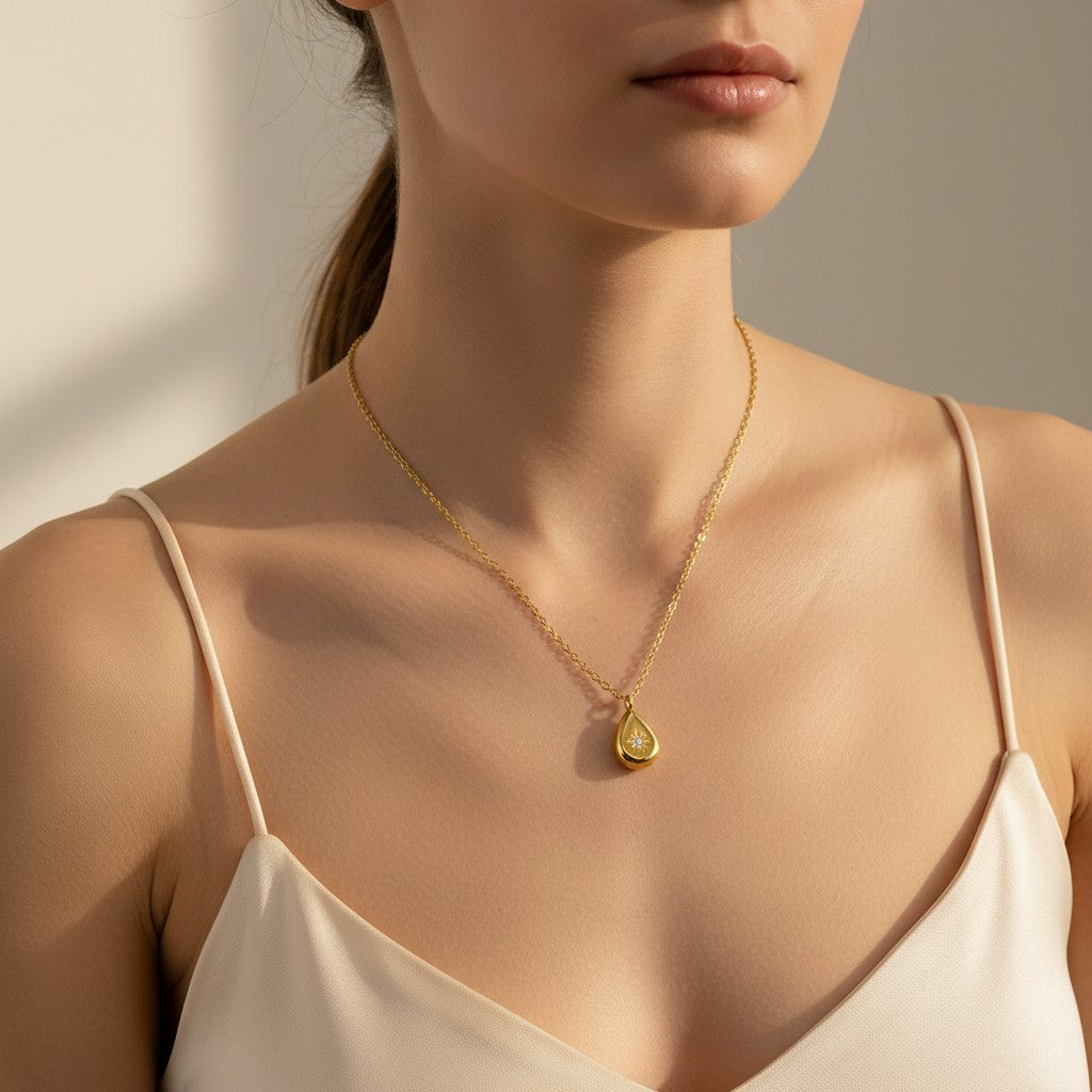 Stella Dewdrop Necklace in 18K gold PVD-plated finish worn on the neck