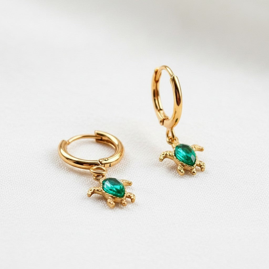 Marina Turtle Earrings, styled flat lay