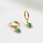 Marina Turtle Earrings, styled flat lay