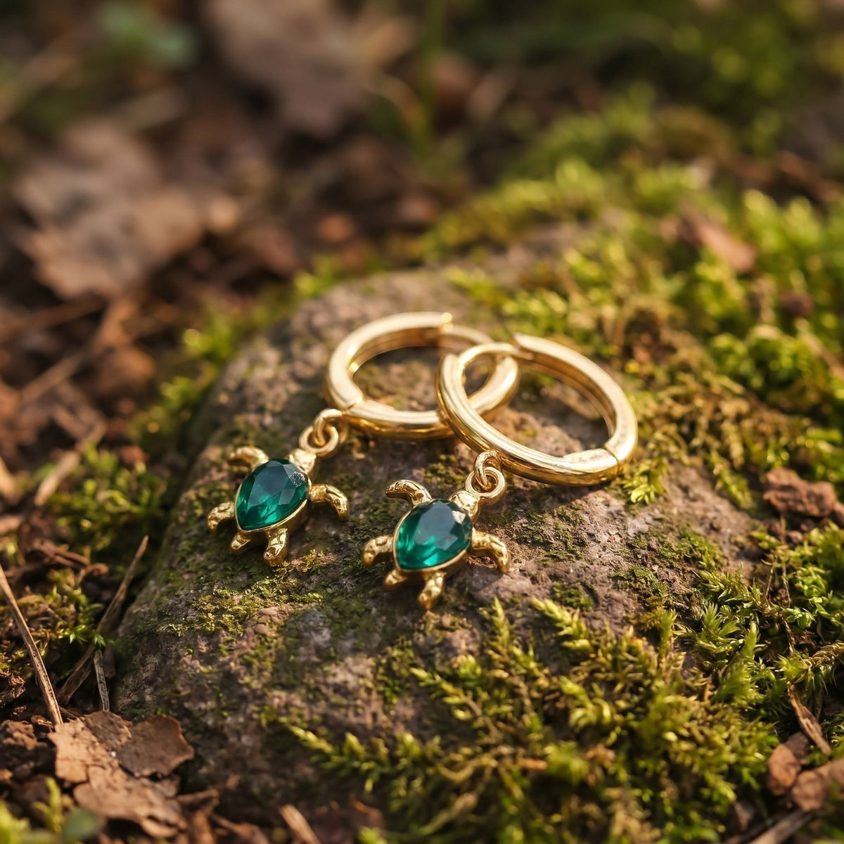 Marina Turtle Earrings, close-up on a display