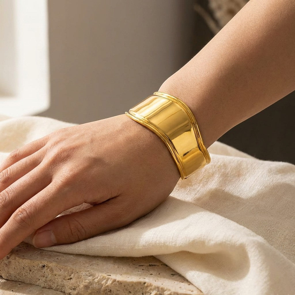 Sol Wave Cuff Bracelet in 18K gold-plated finish worn on the wrist