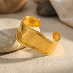 Sol Wave Cuff Bracelet, styled flat lay