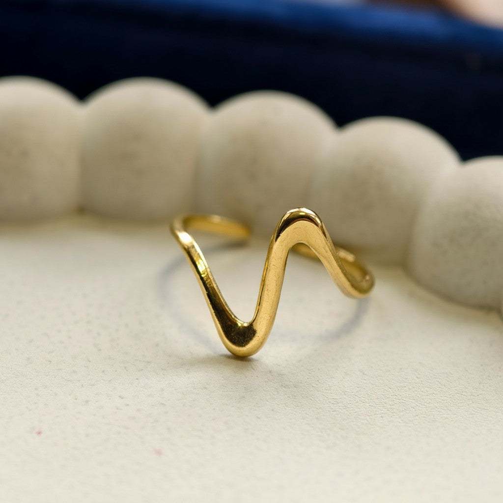 Pretty Shimmering Things Global Zara Wave adjustable ring in polished 18K gold-plated stainless steel with a fluid design