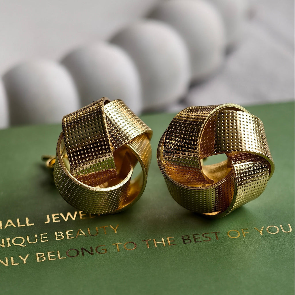 Nova Woven Knot Earrings shown with Pretty Shimmering Things packaging