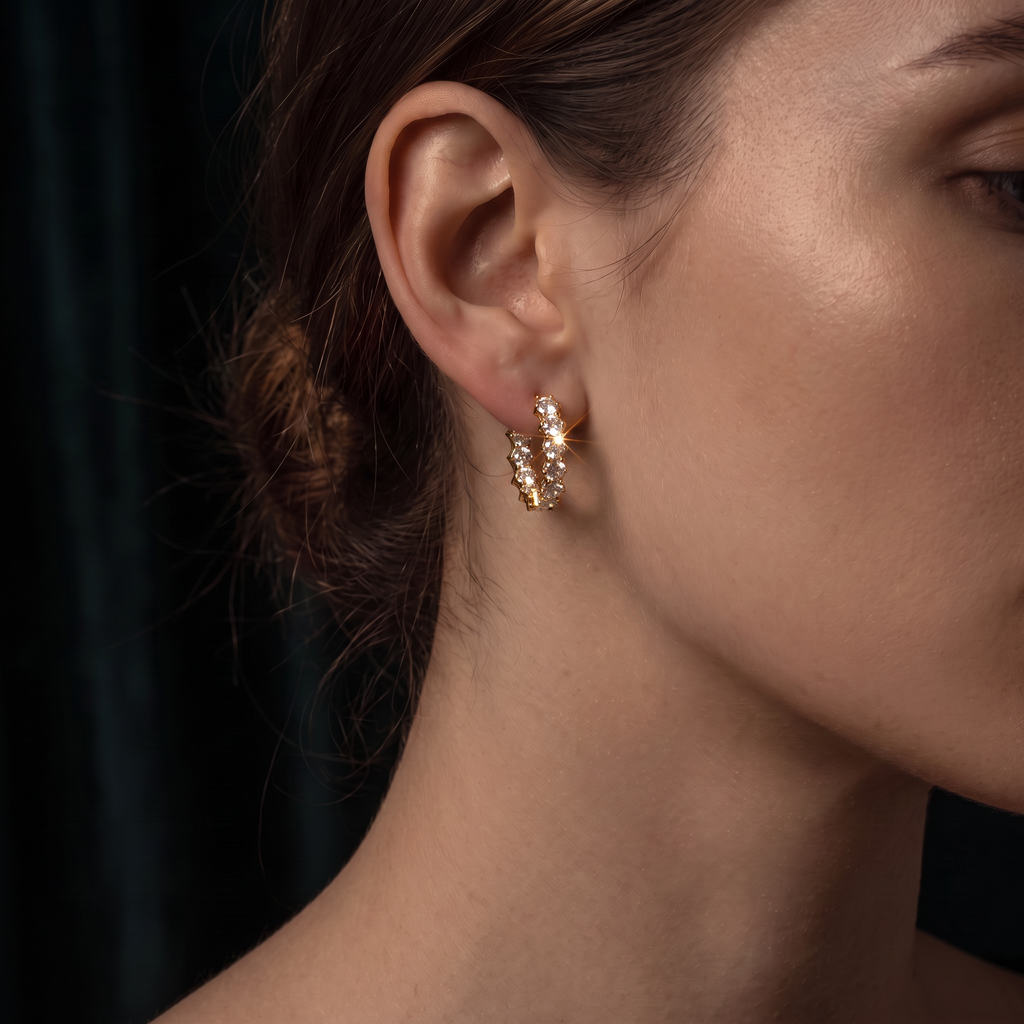 Lyra Crystal Hoop Clips in 18K gold-plated finish worn on the ear