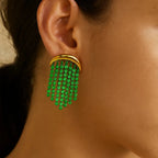 Isla Green Beaded Statement Earrings worn on the ear, close-up