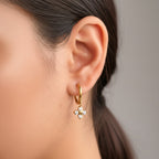 Mira Petal Earrings in 18K gold-plated finish worn on the ear