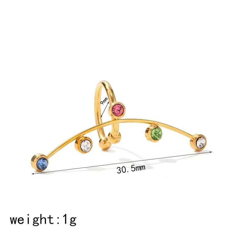 Pretty Shimmering Things Global Vela gold-plated ear cuff with multi-colored zircon stones and stainless steel base.