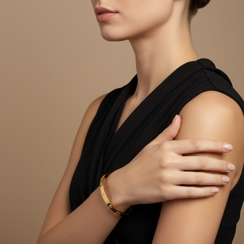 Pretty Shimmering Things Global Stella vintage gold-plated stainless steel bangle with rhinestone accents on a model