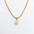 Pretty Shimmering Things gold-toned beaded chain necklace with a single lustrous white pearl pendant.
