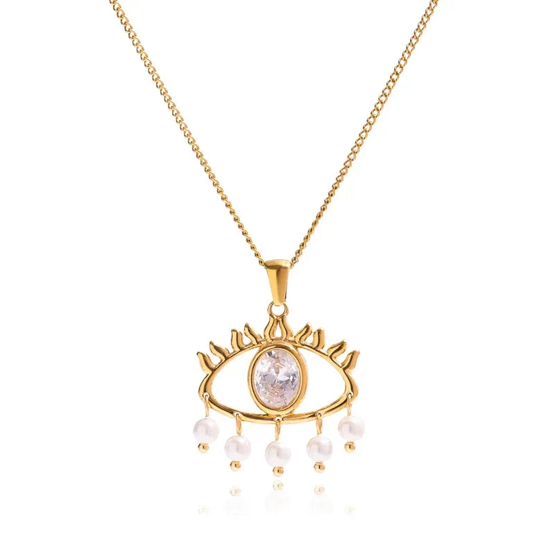 Pretty Shimmering Things gold-tone stainless steel evil eye necklace with a central crystal and dangling faux pearls.