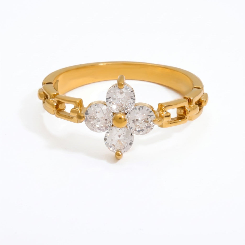 Pretty Shimmering Things gold-tone floral ring with clear cubic zirconia petals and a unique chain-link band design.