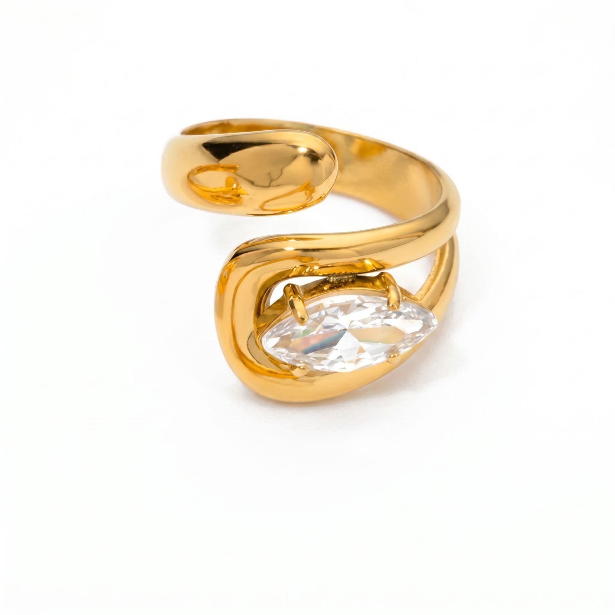 Pretty Shimmering Things gold-tone bypass ring featuring a marquise-cut clear crystal in a polished fluid design.