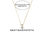 Pretty Shimmering Things gold-tone oval solitaire pendant necklace with a clear cubic zirconia stone on a delicate chain